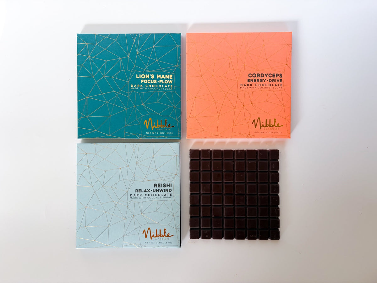 Nibble functional chocolate collection featuring Reishi, Cordyceps and Lion’s Mane dark chocolate bars.