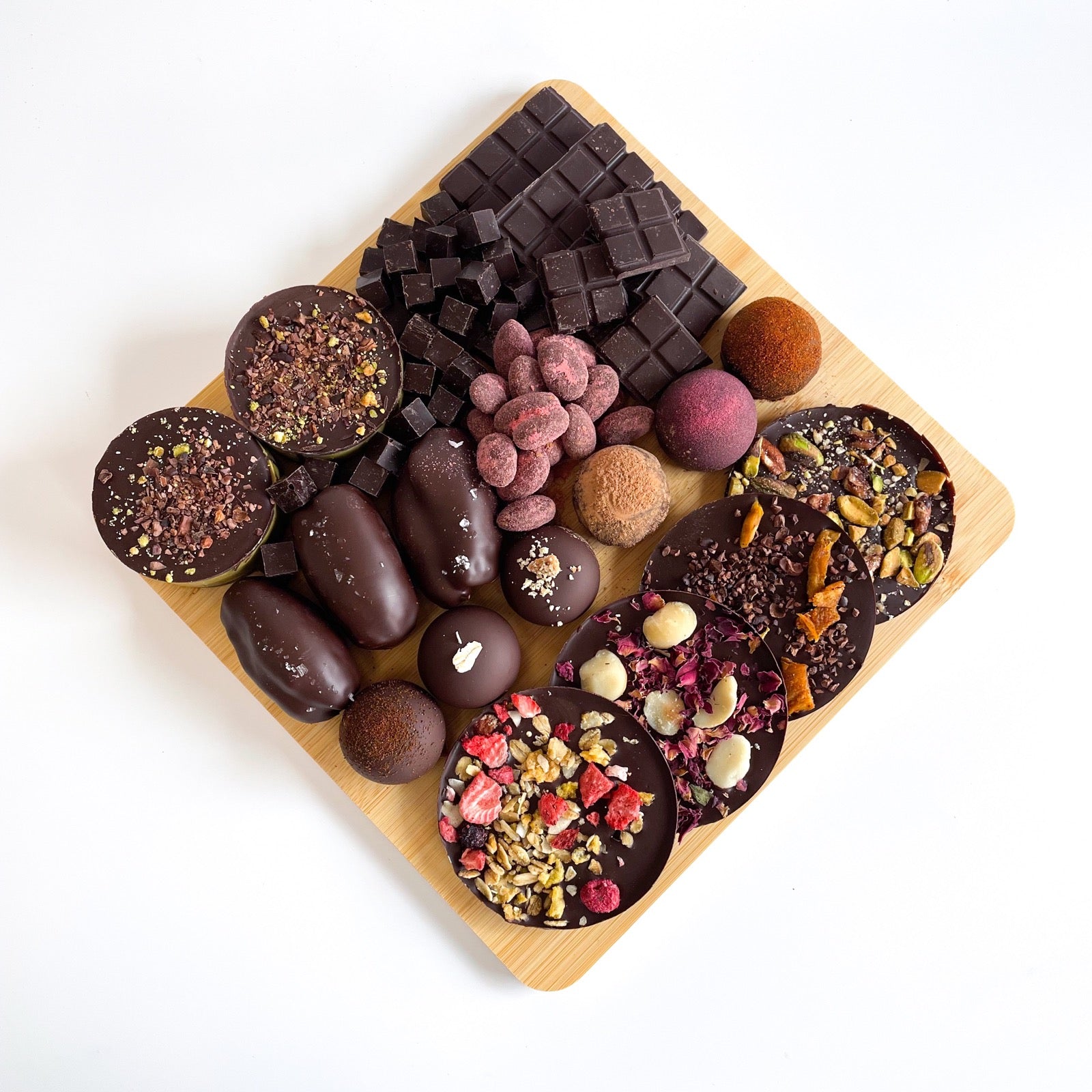 An assortment of chocolate bars, truffles, discs and chocolate-covered treats